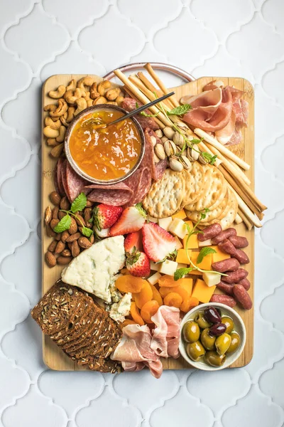 stock image Antipasto meat board. catering platter with jamon, sausage and cheese. Food recipe background. Close up.