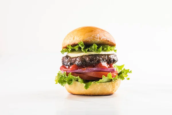 stock image Delicious juicy grilled burger on wheat buns.  Studio macro shot