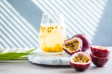 Pure passion, alcoholic cocktail with syrup, lime, orange juice, soda, ice and passion fruit