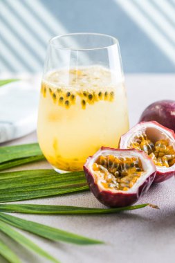 Pure passion, alcoholic cocktail with syrup, lime, orange juice, soda, ice and passion fruit