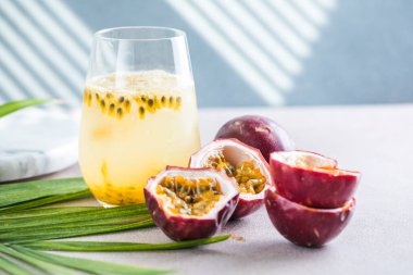 Pure passion, alcoholic cocktail with syrup, lime, orange juice, soda, ice and passion fruit