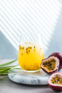 Pure passion, alcoholic cocktail with syrup, lime, orange juice, soda, ice and passion fruit