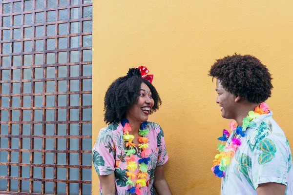 Afro couple celebrating street carnival