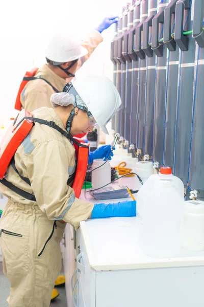 Marine biologists immersed in research aboard a vessel