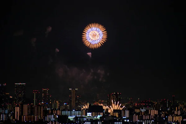 View of fireworks during a summer festival with a clear sky night Osaka, Japan