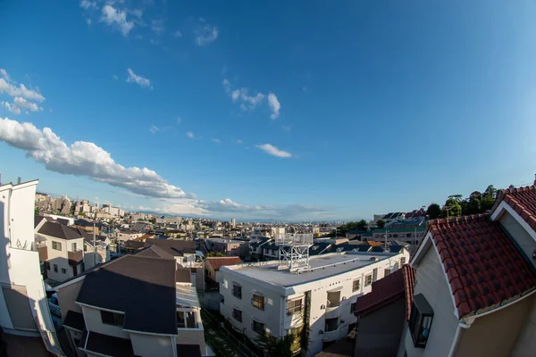 stock image View of a Japanese neighborhood with many buildings and houses in a sunny day during afternoon (Toyonaka, Osaka, Japan) (20221203-019)