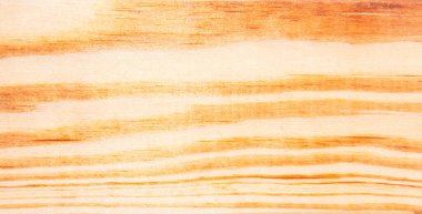 Ahşap parçasının detaylı bir yakın çekimi, ahşap yüzeyin karmaşık tahıl desenlerini ve dokusunu gözler önüne seriyor.