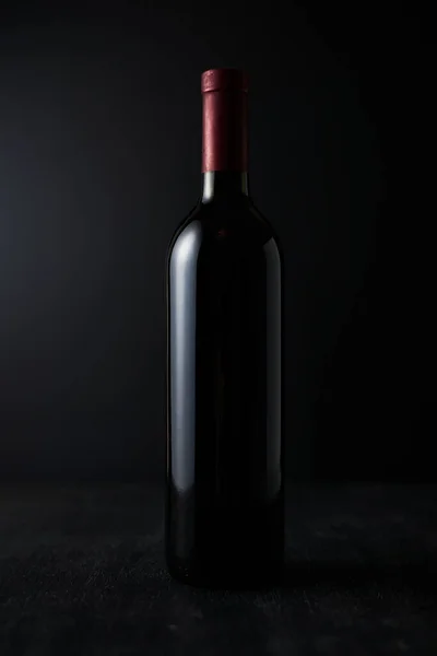 bottle of wine on dark background