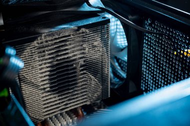 Close-up of a PC cooling system, a dirty radiator from a computer.