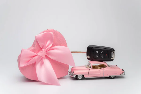 Toy car with key and gift box. Gift car for Valentines day.