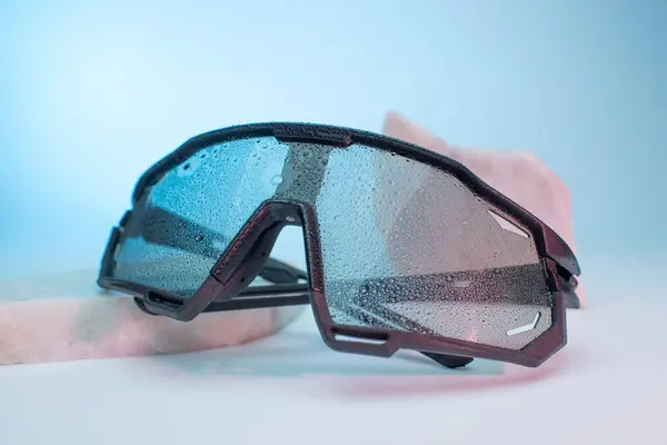 Sport glasses on neon background.