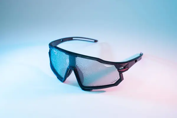Sport glasses on neon background.
