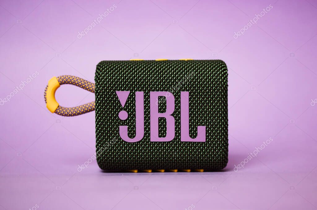 Kyiv, Ukraine. March 3, 2020. JBL GO 3 acoustic music speaker. Rectangular music playback speaker with purple JBL lettering on lilac background. Beautiful modern stylish musician equipment. A brand.