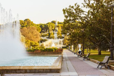 Zaragoza Spain. Beautiful city park with fountains, paths, benches. A peaceful place to relax in nature in the big city in sunny summer autumn day. Travel around the world botanical gardens.