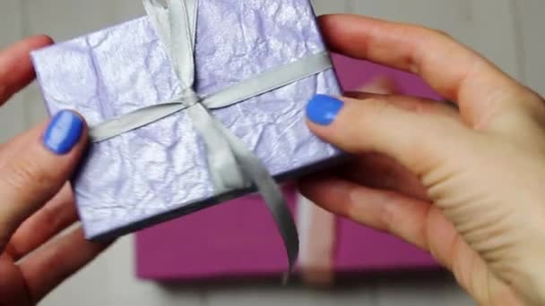 Purple Gift Box Silver Silk Bow Woman Hand Gray Background — 비디오