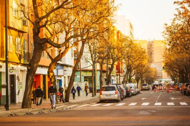 Zaragoza, Spain October 16, 2022 Autumnal city street Residential apartment houses, modern neighborhood. Multifamily buildings. Real estate investment. Suburb area for living. Asphalt road in distance