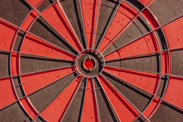 Red black dart wall. Round shape background, wallpaper. Dartboard center ring with the bull eye. Target of business, opportunity concept Abstract circle for concentration Play a game. Spherical grunge