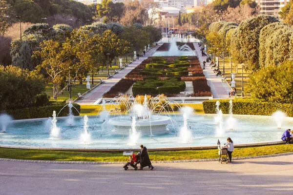 stock image Zaragoza, Spain. February 16, 2023 People walking in Great City Park Grande Jose Antonio Labordeta Botanical gardens sculptures fountains trees, bushes in sunny day Journey, travel vacations in Europe
