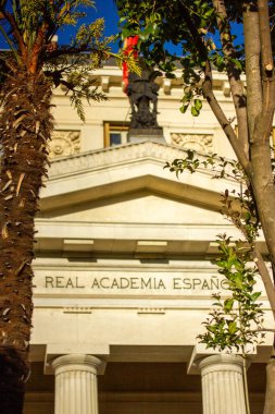 Madrid, Spain. May 1, 2024 Royal Spanish Academy. 'Real Academia Espanola' Old Spanish orange building, columns. Historical neoclassical architecture. clipart