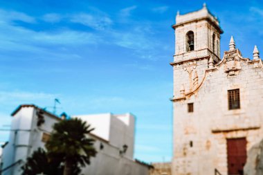 Castellon, Spain, 1 May 2024 Church of Our Lady of the Ermitana. An ancient historical building against blue sky Travel postcard with space for text. clipart