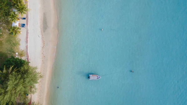 Drone aerial view at the Klong Prao Beach in Koh Chang, drone view from above at turquoise colored ocean.