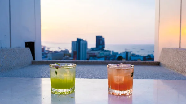 stock image cocktail drinks on a rooftop bar in Pattaya Thailand during sunset