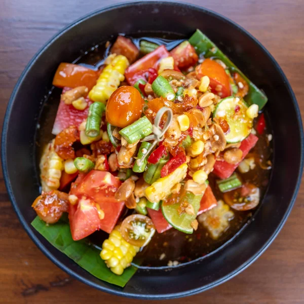 stock image spicy salad, som tam, or spicy papaya salad Top view at the table with Thai food. 