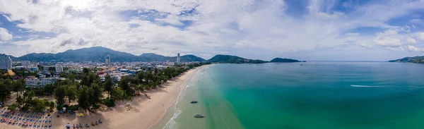 stock image Patong beach Phuket, drone view of tropical beach with beach chairs and palm trees in the morning