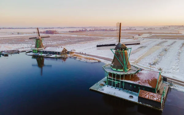 Zaanse Schans windmill village during winter with snow landscape in the Netherlands Holland village in winter