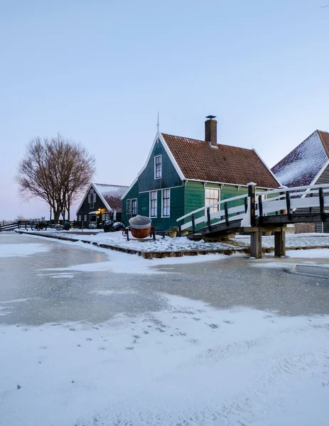 Zaanse Schans windmill village during winter with snow in the Netherlands Holland village in winter