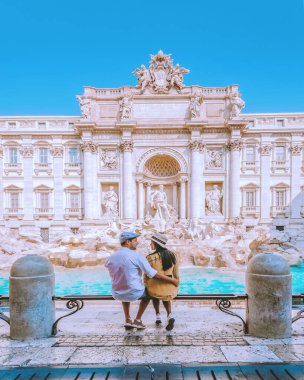 Trevi Fountain, Rome, Italy. City trip Rome couple on a city trip in Rome Italy clipart