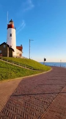 Hollanda 'da gün batımında Urk Hollanda Deniz Feneri. 