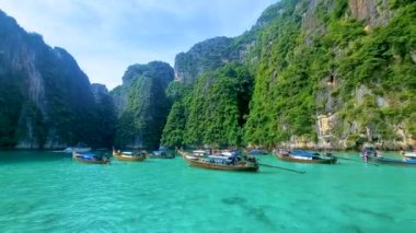 view of the turqouse colored ocean with longtail boats at Koh Phi Phi Don Thailand. 