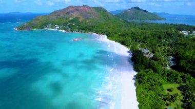 Seychelles Tropical Island Praslin with a white beach and tropical palm trees, Drone aerial view over Seychelles. 