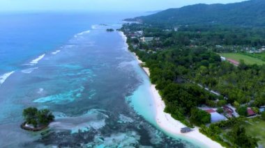 Coral reef at Anse Source D Argent beach La Digue Island Seychelles aerial view on tropical beach Seychelles.