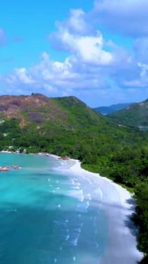 Seychelles Tropical Island Praslin with a white beach and tropical palm trees, Drone aerial view over Seychelles. 
