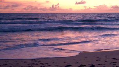 Sunset on the beach of Phuket Thailand with beautiful sky pink orange colors. 