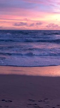 Sunset on the beach of Phuket Thailand with beautiful sky pink orange colors. 