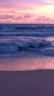 Sunset on the beach of Phuket Thailand with beautiful sky pink orange colors. 