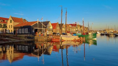 Urk Flevoland Netherlands August 2020, sunset at the lighthouse and harbor of Urk Holland. Fishing village Urk. Beautiful sunset during the evening