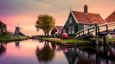 Zaanse Schans Netherlands a Dutch windmill village during sunset whit a wooden house holland dutch history
