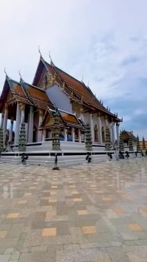 Thai Buddhist temple Bangkok Thailand, Wat Suthat, better known for the towering red Giant Swing that stands at its entrance, is one of the oldest and most impressive Buddhist temples in Bangkok