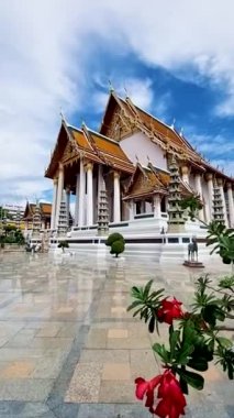 Thai Buddhist temple Bangkok Thailand, Wat Suthat, better known for the towering red Giant Swing that stands at its entrance, is one of the oldest and most impressive Buddhist temples in Bangkok
