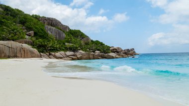 white tropical beach and palm trees Coco Island Tropical Seychelles Islands. 
