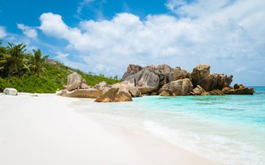 Anse Cocos beach with huge granite boulders at La Digue Seychelles Islands. 