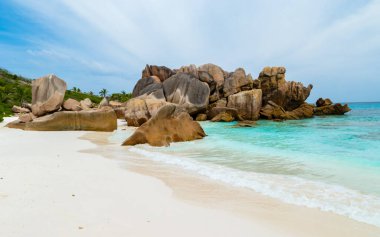 Anse Cocos beach with huge granite boulders at La Digue Seychelles Islands. 