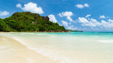 white tropical beach with turquoise colored ocean Anse Volbert beach Praslin Tropical Seychelles Islands. Cote Dor beach