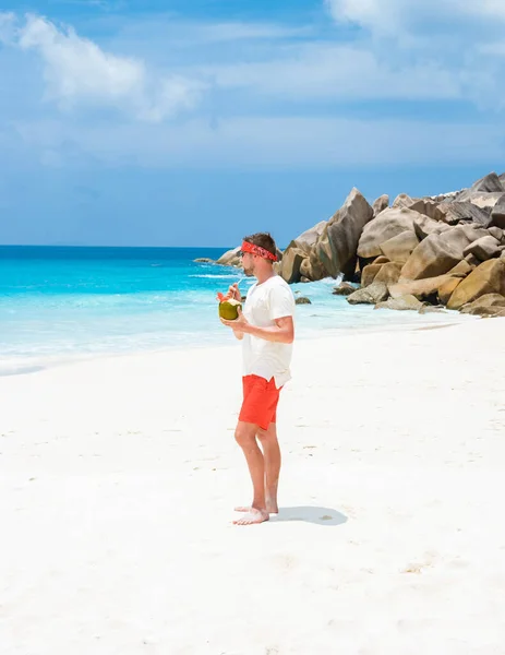 Young Men Swim Short Coconut Drink Tropical Beach Digue Seychelles — Stok Foto