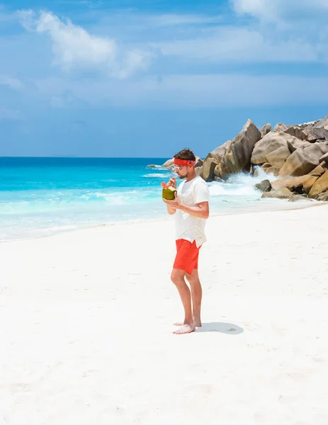 Young Men Swim Short Coconut Drink Tropical Beach Digue Seychelles — Stockfoto