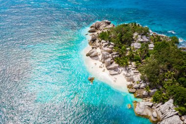 Drone view from above at a tropical beach in the Seychelles Cocos Island.